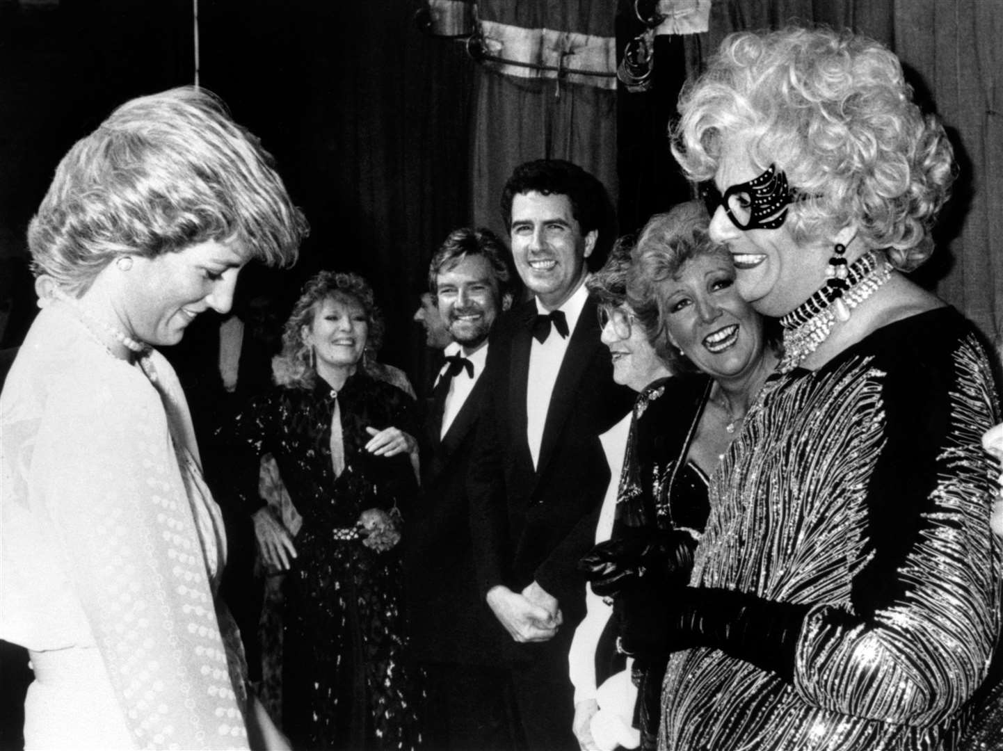 The Princess of Wales enjoying a chat with Dame Edna Everage (alias Barry Humphries) backstage at the Golden Jubilee concert at the London Palladium in 1987 (PA)