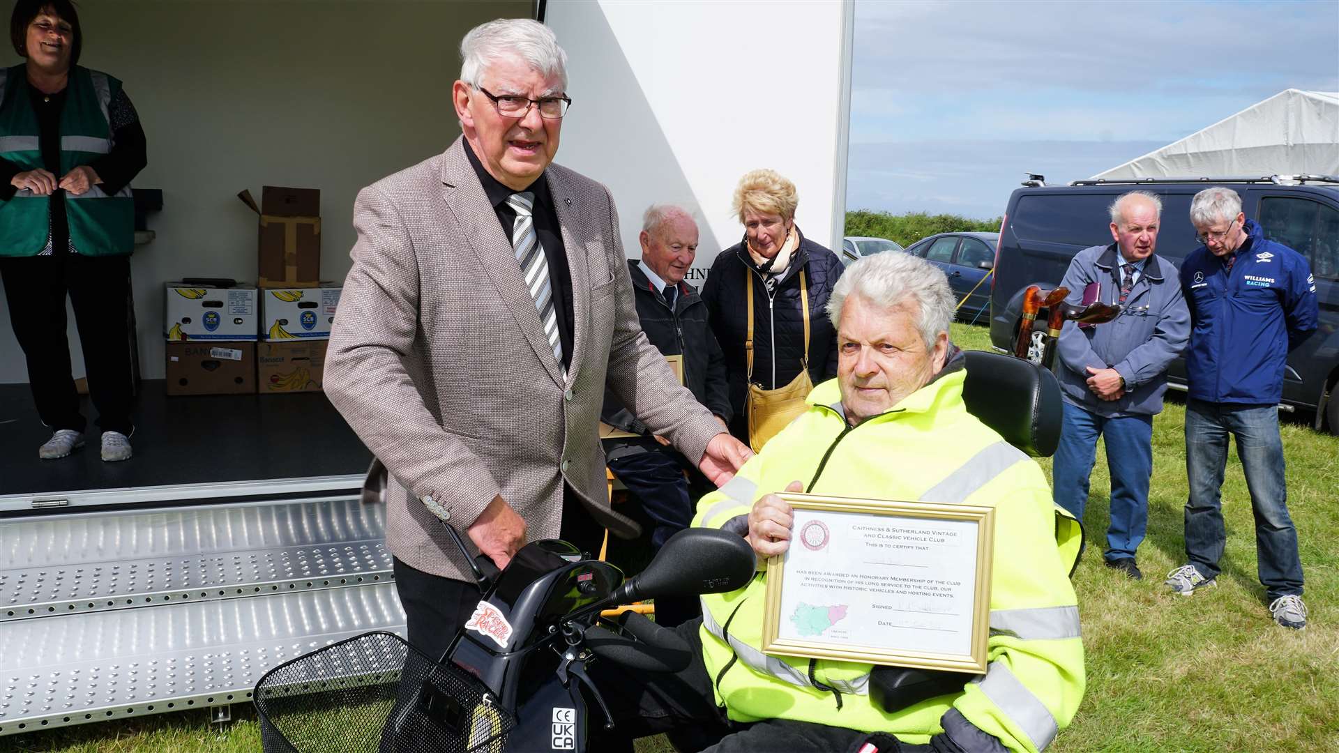 Iain Sutherland gives an honorary award to the late David Green at the club's annual rally in John O’ Groats earlier this year. Picture: DGS