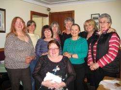 North and West Sutherland Care Alliance (NWSCA) coordinator Sylvia Mackay (seated) whose battle to save the group has been unsucessful, was presented with money collected from grateful clients and staff. Along with NWSCA’s team of carers, Sylvia is transf