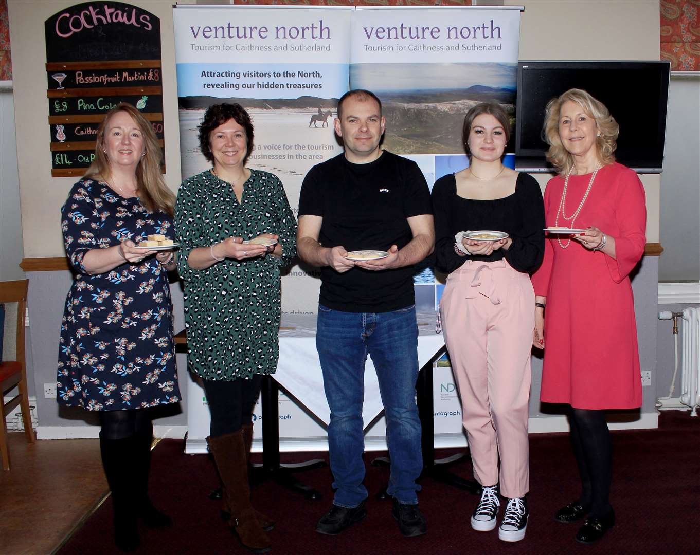 Cathy Earnshaw (left) and Ellie Lamont (right) of Venture North with Shortbread Showdown judges and Donna Booth, Gary Reid and Iona Simpson in Mackays Hotel. Picture: Alan Hendry