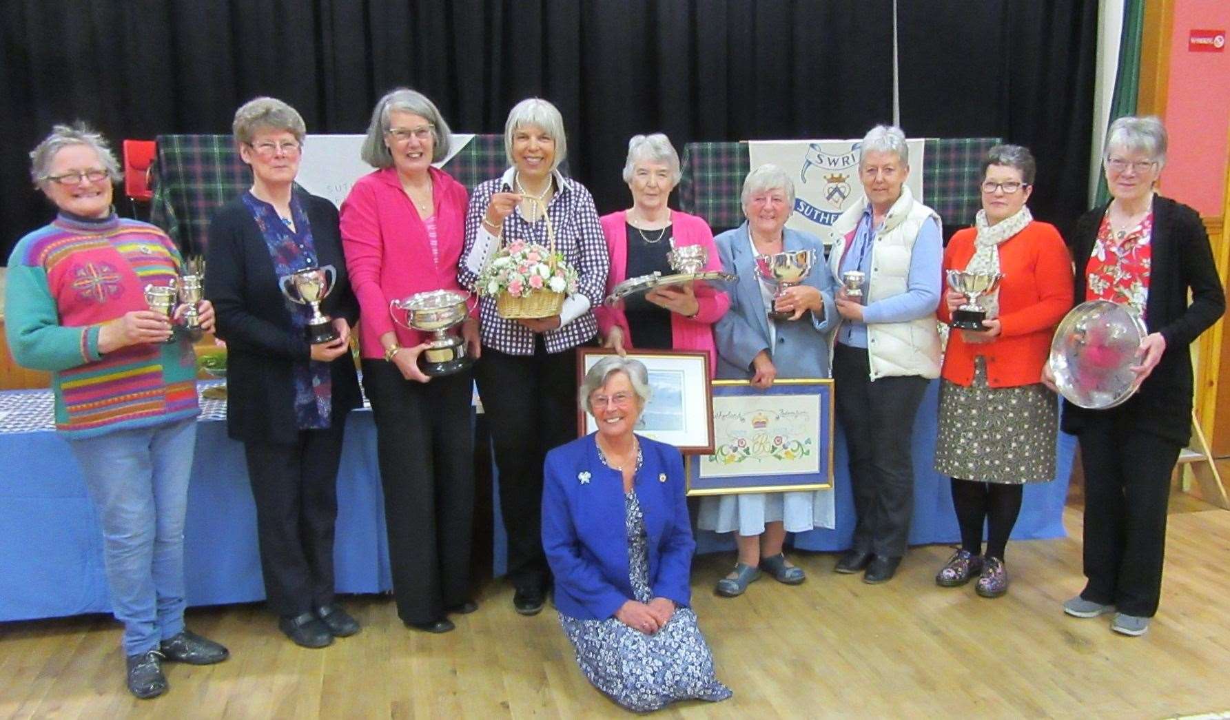Federation chairwoman Jean Cameron (kneeling front) with prizewinning SWI members and Northern Times reporter Caroline McMorran (fourth left) who presented the trophies.