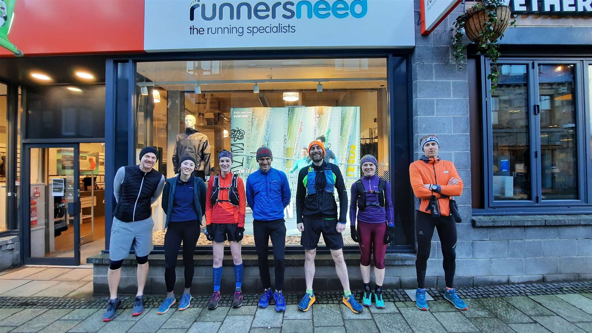 Runners Paul, Amy, Lisa, George, John, Louise and Jon are raring to go outside the Runners Need shop in Fort William.