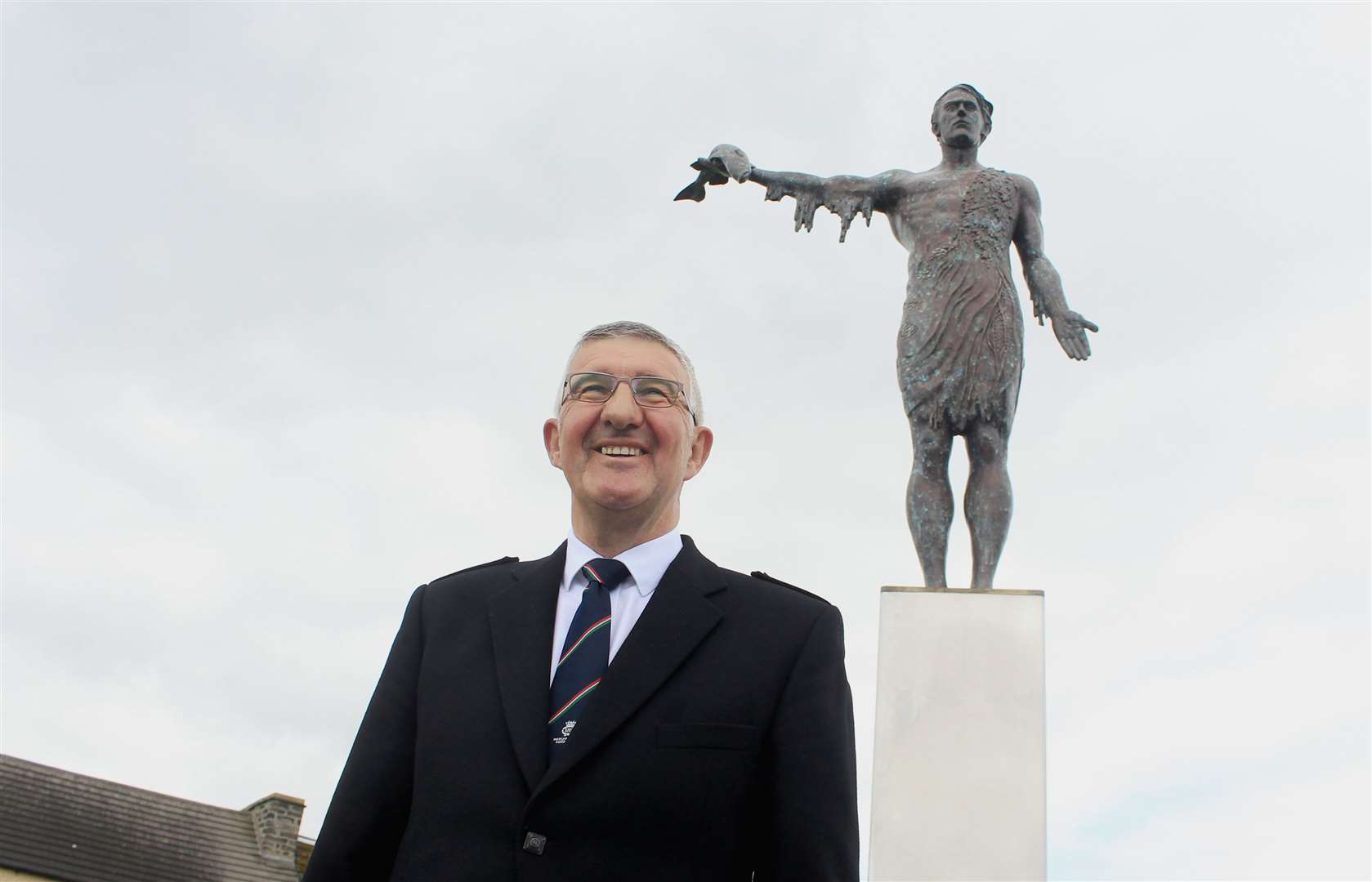 Willie Watt, chairman of the Seafarers Memorial Group, in front of the new statue created by Alan Beattie Herriot. Picture: Alan Hendry