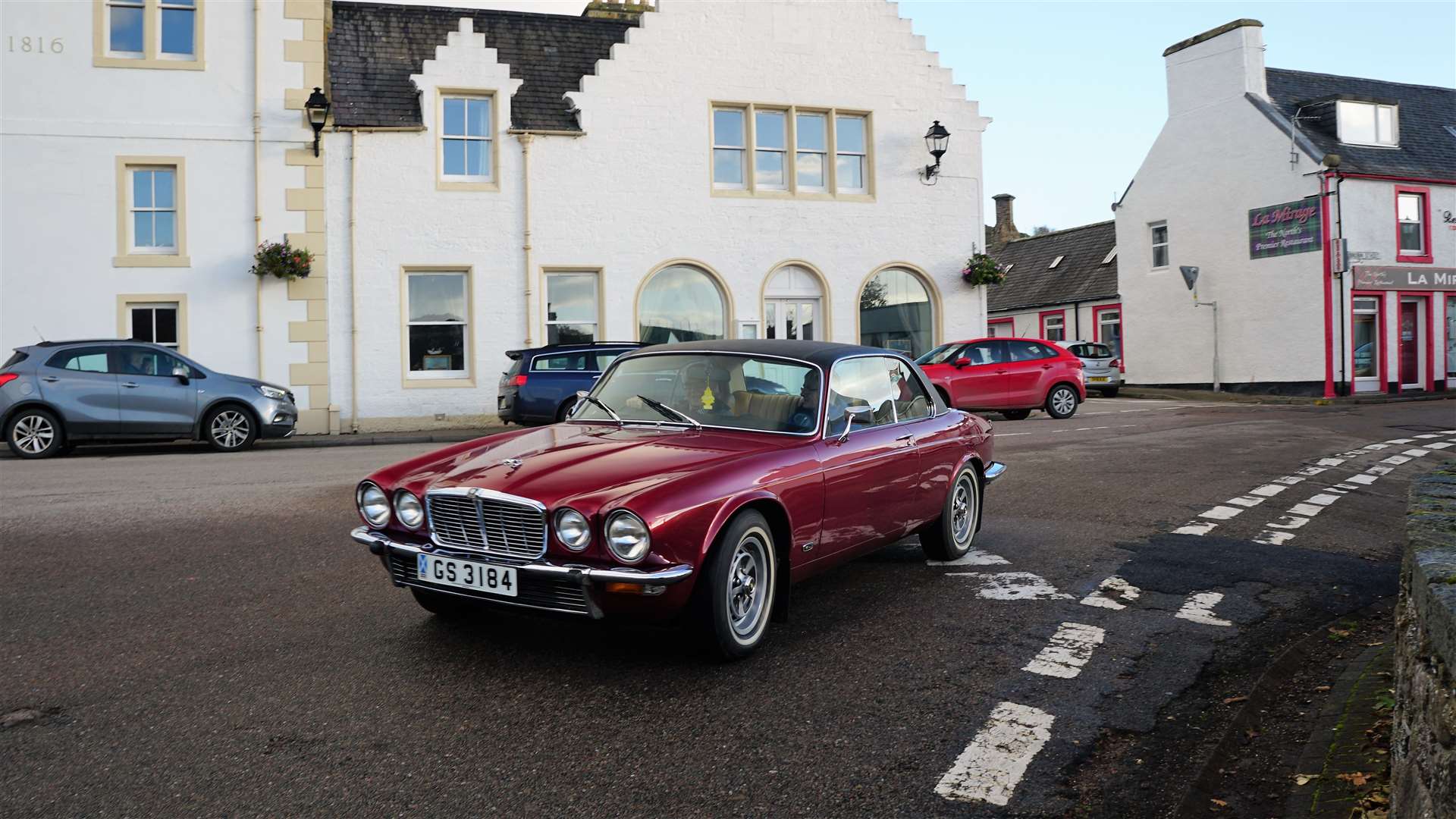 Vintage Jaguar making its way past the Bridge Hotel in Helmsdale. Picture: DGS