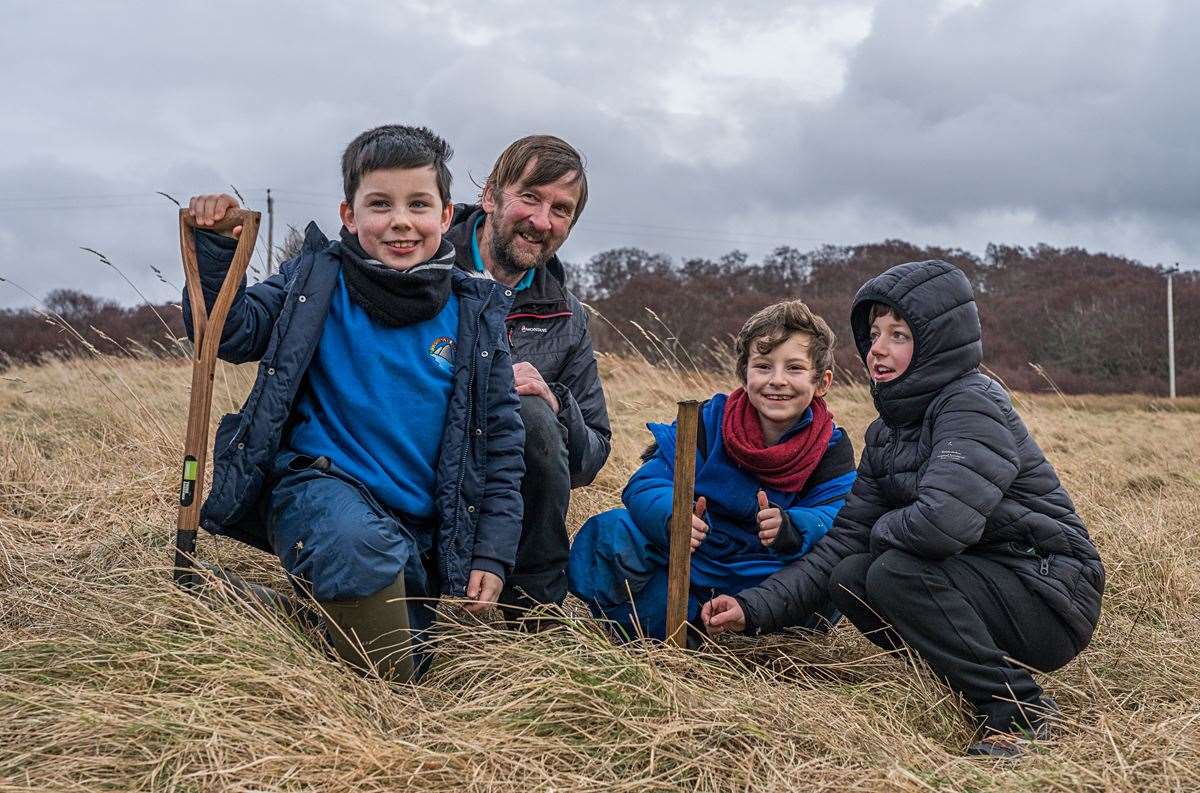 A lovely image of countryside ranger Andy Summers with some of the children involved in the wych elm event. Picture: Chris Puddephatt
