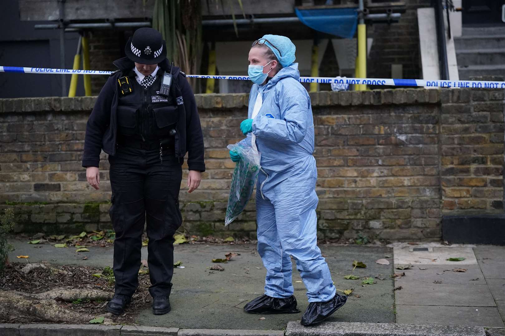 Police at the scene in east London (Yui Mok/PA)