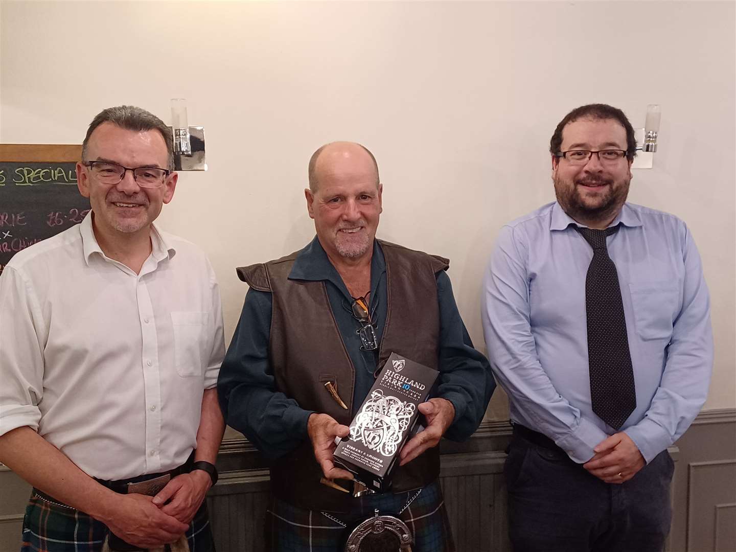 Sandy Fraser (centre) at the retirement dinner with Alan Yates (left), Highland Council environmental health manager, and Daniel Hopwood, senior environmental health officer.