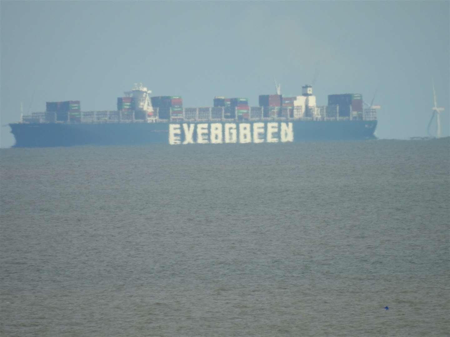 The Ever Given can be seen from Felixstowe waiting to berth in the Port of Felixstowe in Suffolk (Nigel Pickover/PA)
