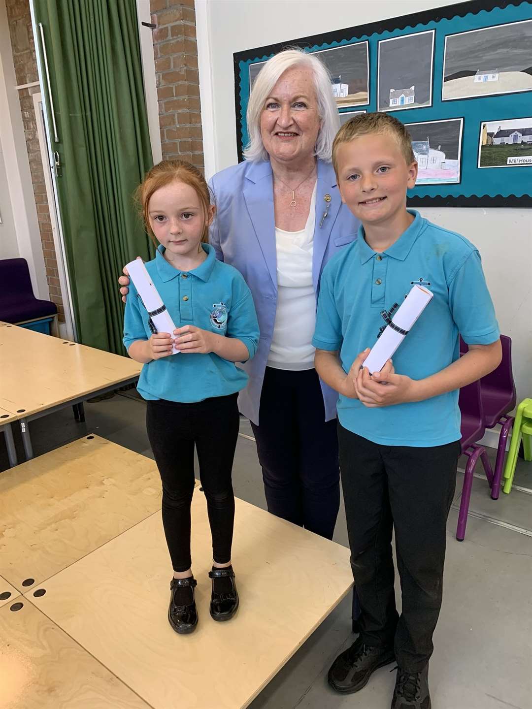Deputy Lieutenant Frances Gunn visited Melvich Primary School to present the Coronation Art Competition certificates to pupils. Ella Will won the p1-3 category and Benjamin Mackinnon the p4-7 class.