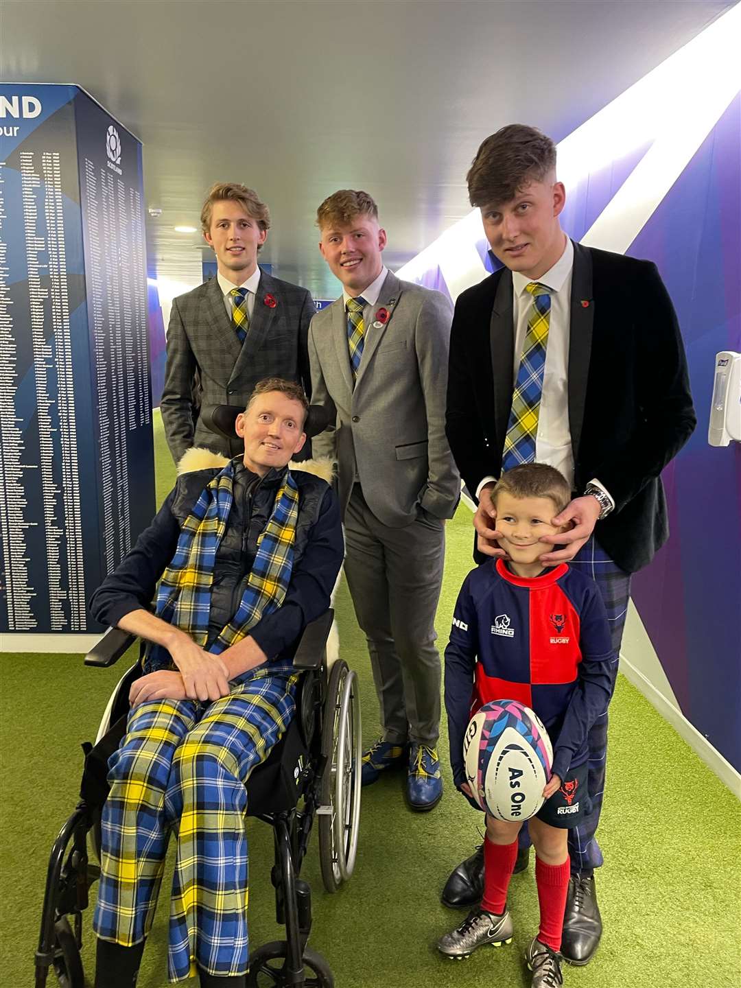 Invergordon and Ross Sutherland youngster Charlie Mackenzie (6) joined Doddie Weir and family to deliver the match ball during an Autumn Nations Series match between Scotland and New Zealand at BT Murrayfield.