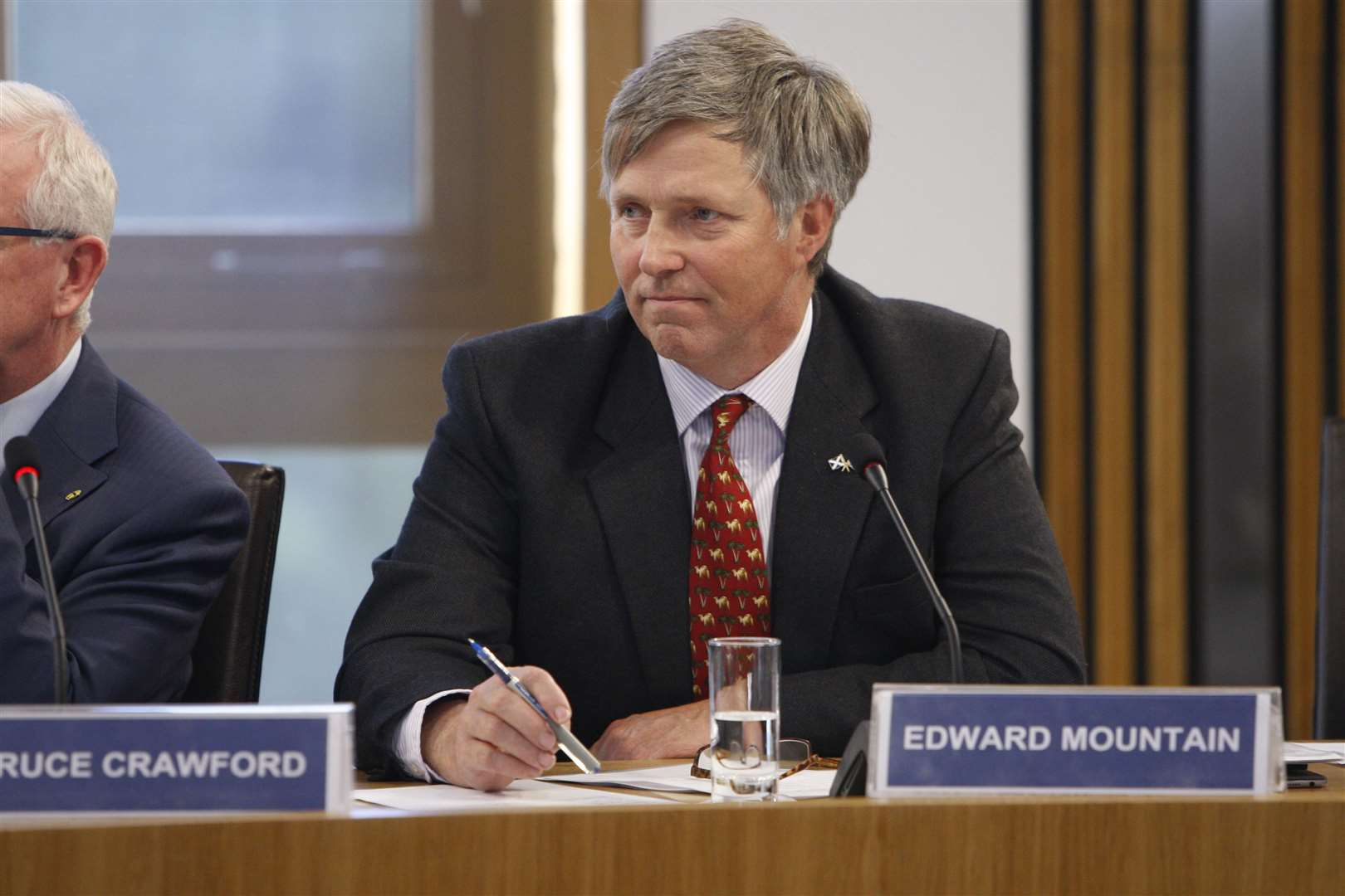 MSP Edward Mountain, the convener of the rural economy and connectivity committee, questioned the timeline for delivering R100.