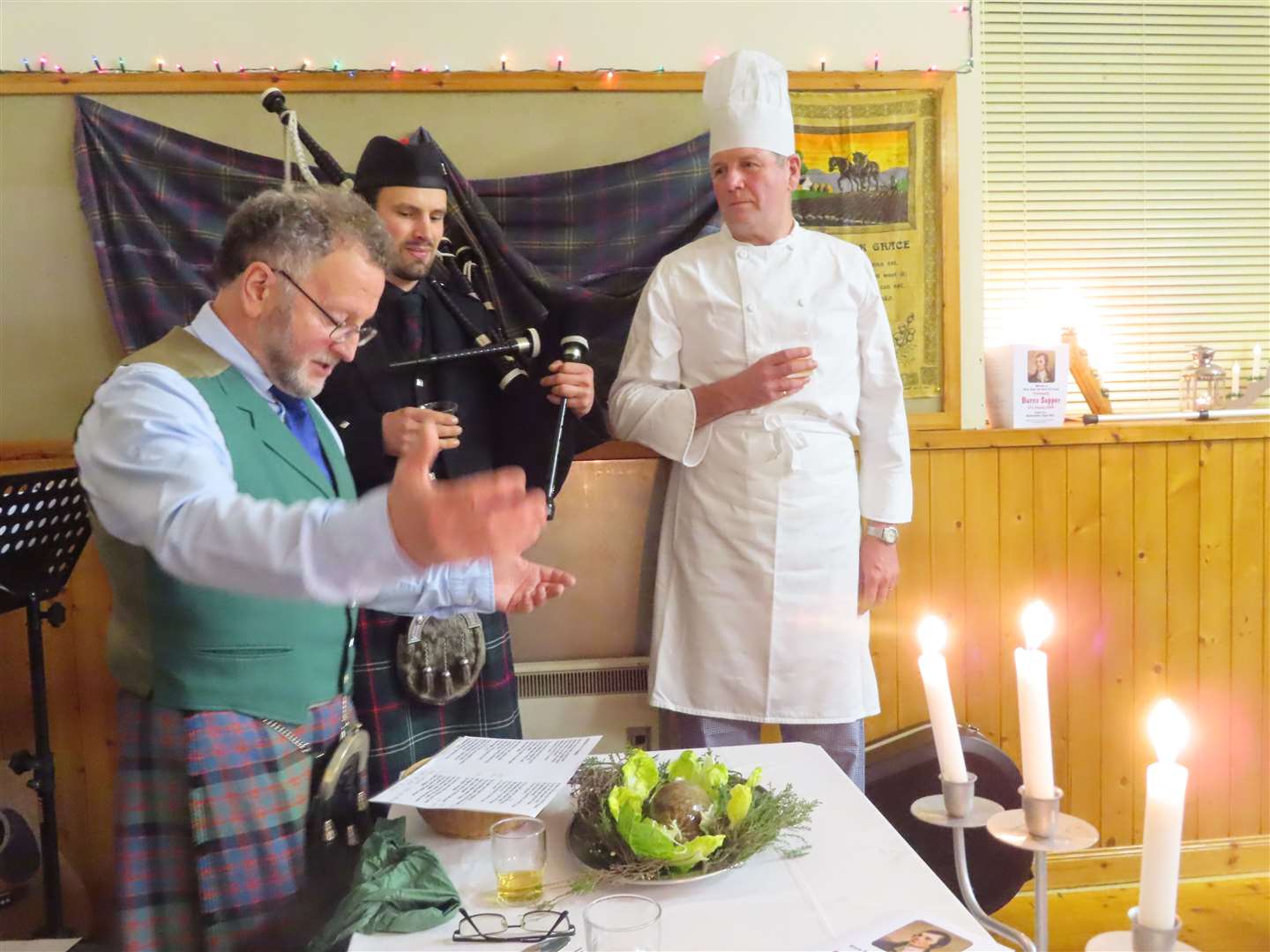 Jimmy MacDonald addresses the haggis after it was piped in by Malcom Paton. Chef Colin Howell looks on.