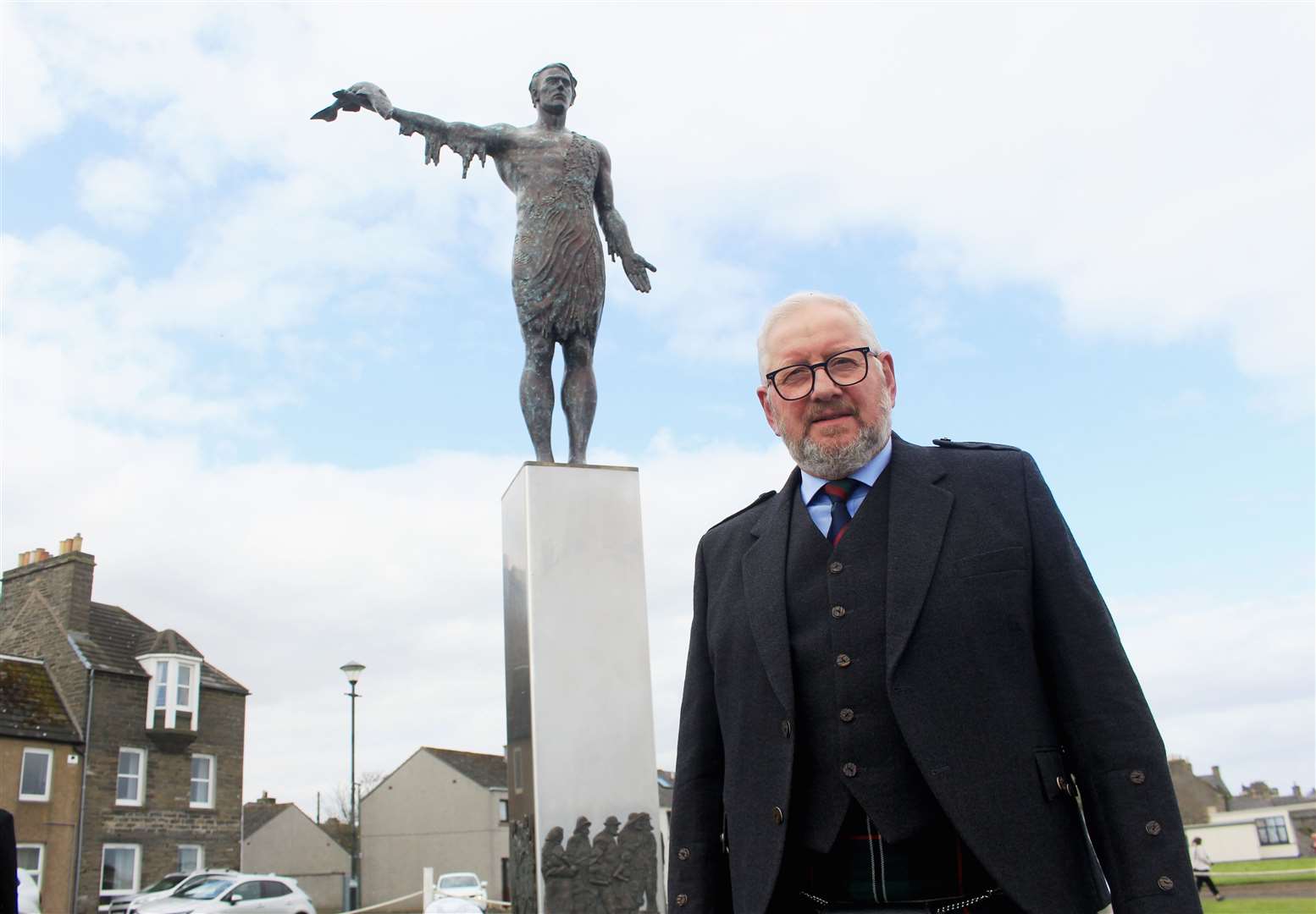 Sculptor Alan Beattie Herriot in front of the Braehead statue symbolising how 'the sea gives with one hand and takes away with the other'. Picture: Alan Hendry