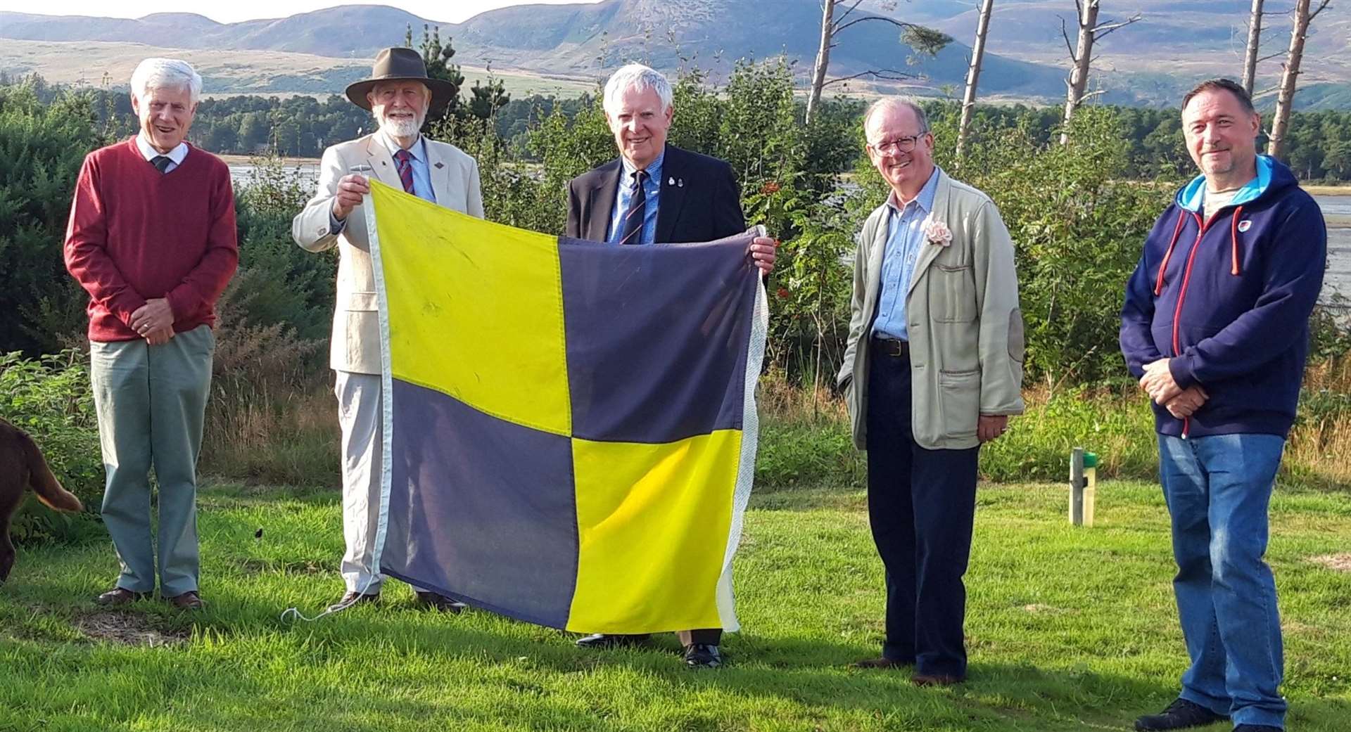 New president of the Sutherland branch of SSAFA Major General Patrick Marriott (fourth left) at the Yellow Jack lowering ceremony. From left are SSAFA colleagues, branch secretary Alasdair Miller, retired case worker Jonathan Brett Young, chairman William Sutherland and case worker Kenny McAulay.