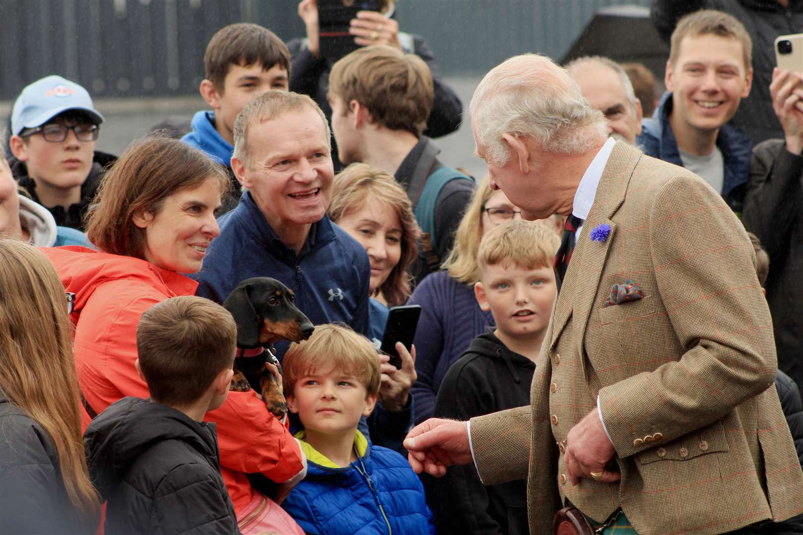 His Majesty meets some of the crowd outside the distillery. Picture: Alan Hendry