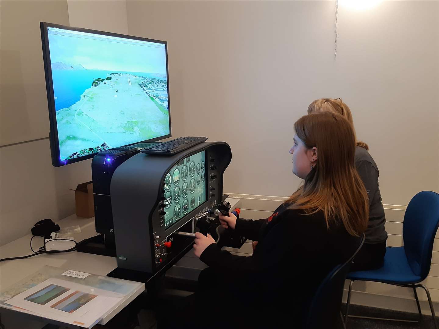 Pupils from Thurso High School have a go on the flight simulator. Picture: HIE