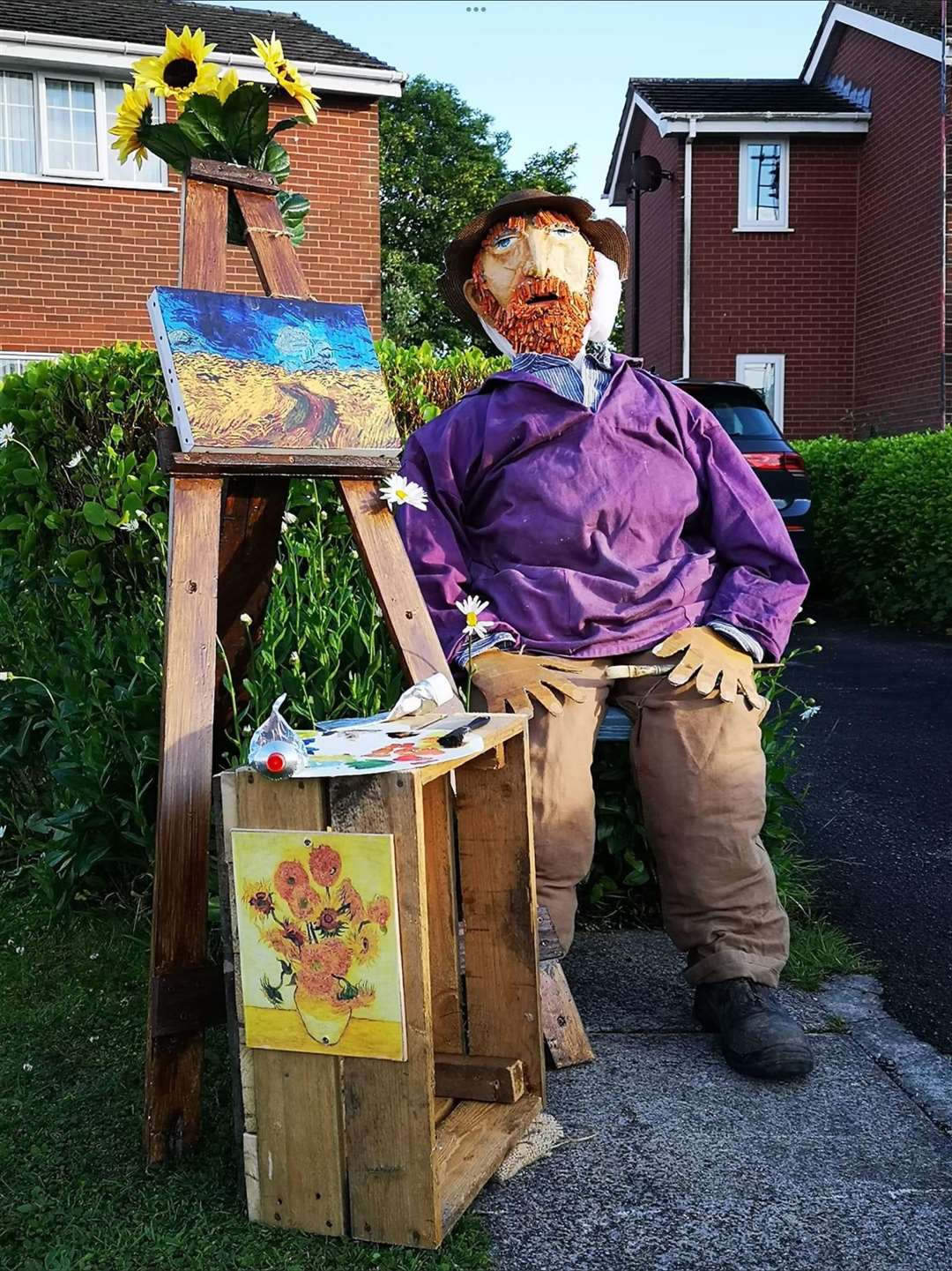Louise Henson and Lizzy Heritage judged the best scarecrow in the competition, with the winner receiving a box of beer from the local brewery (Louise Henson/PA)