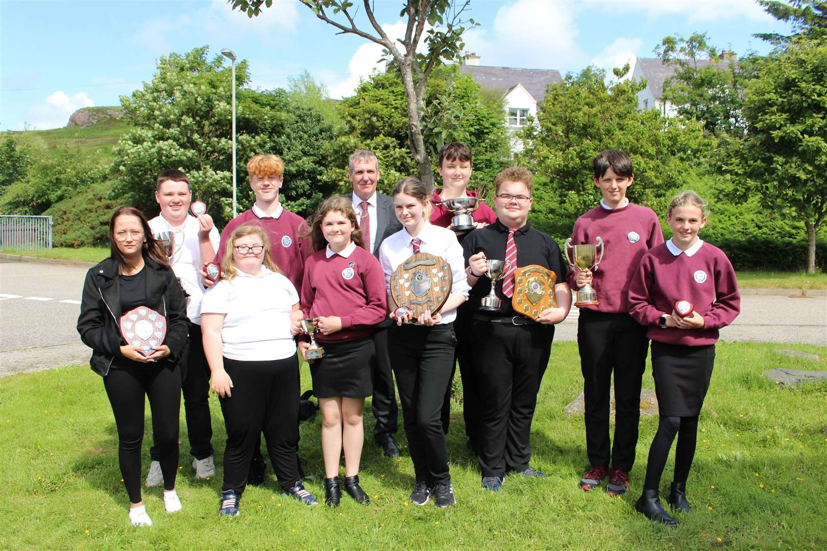 Outgoing head teacher Grame Smart with prize-winners at Kinlochbervie High School after the awards ceremony yesterday.