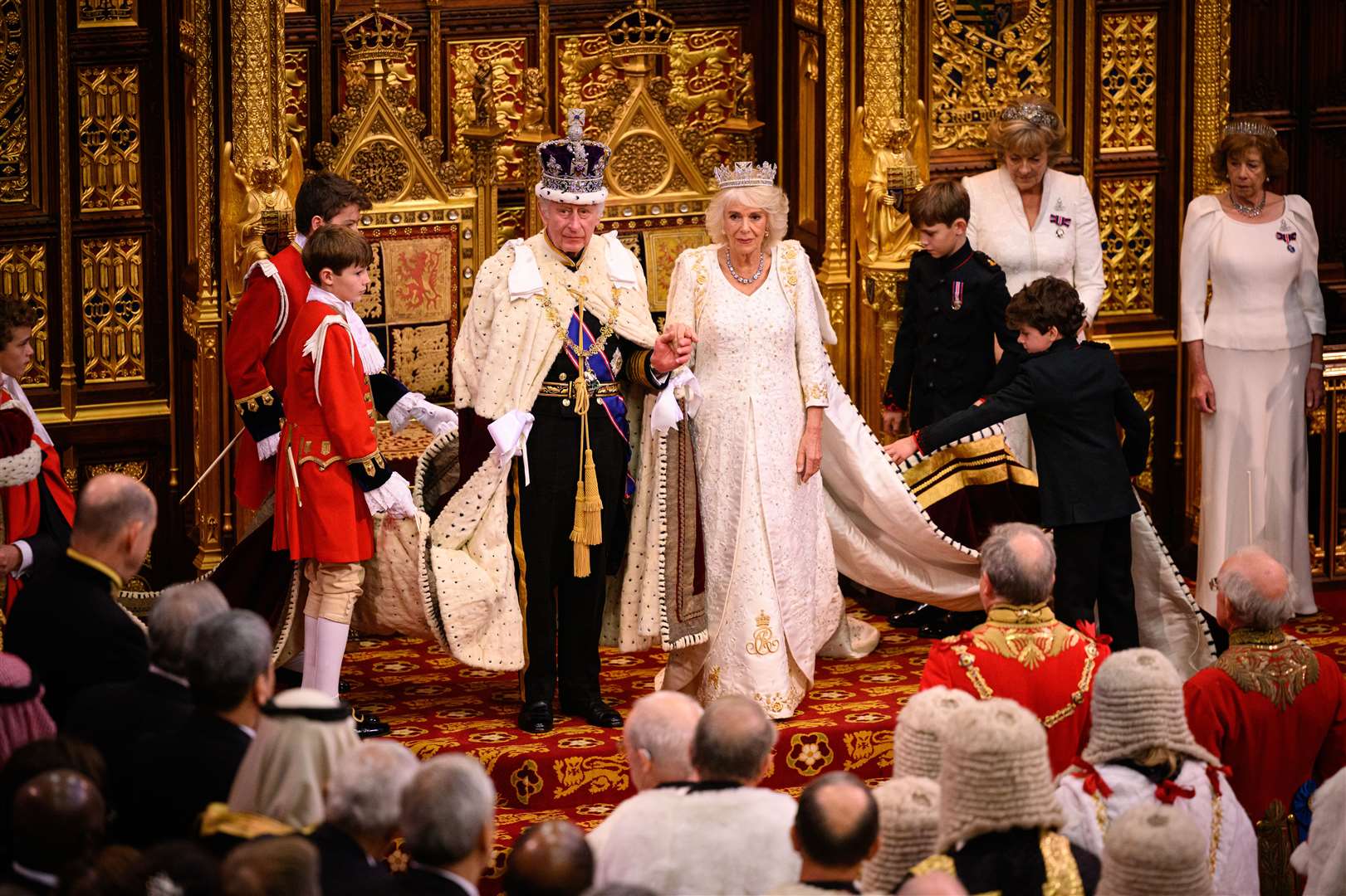The King stands after delivering a speech beside the Queen during the State Opening of Parliament (Leon Neal/PA)