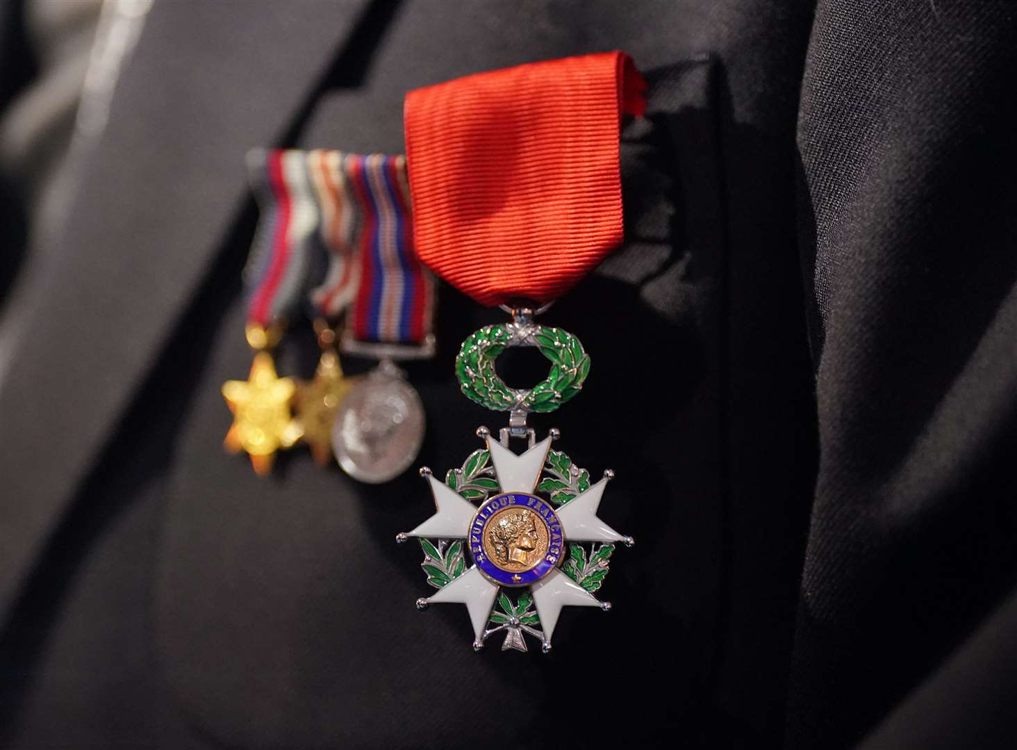 David Morgan proudly displays the Legion of Honour after the ceremony (Yui Mok/PA)