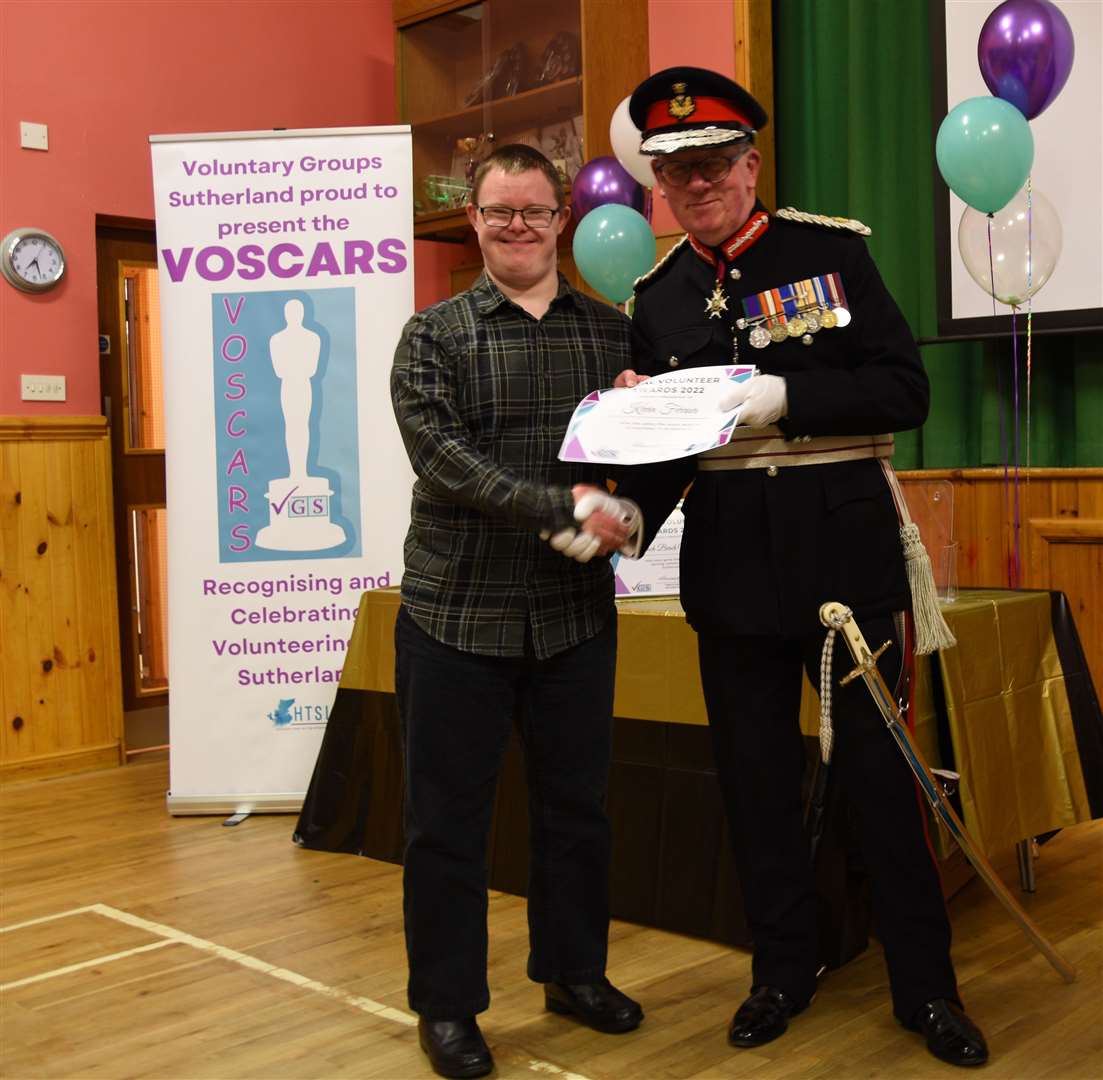 Volunteer Kevin Ferrier was presented with a Voscars award.