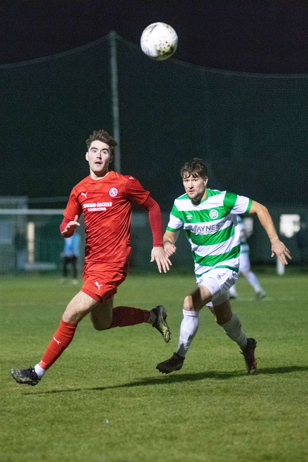 Brora Rangers' Max Ewan (left) and Buckie Thistle's Sam Urquhart (right) chase down the ball...Buckie Thistle FC (5) vs Brora Rangers FC (0) - Highland Football League - Victoria Park, Buckie 16/02/2022...Picture: Daniel Forsyth..
