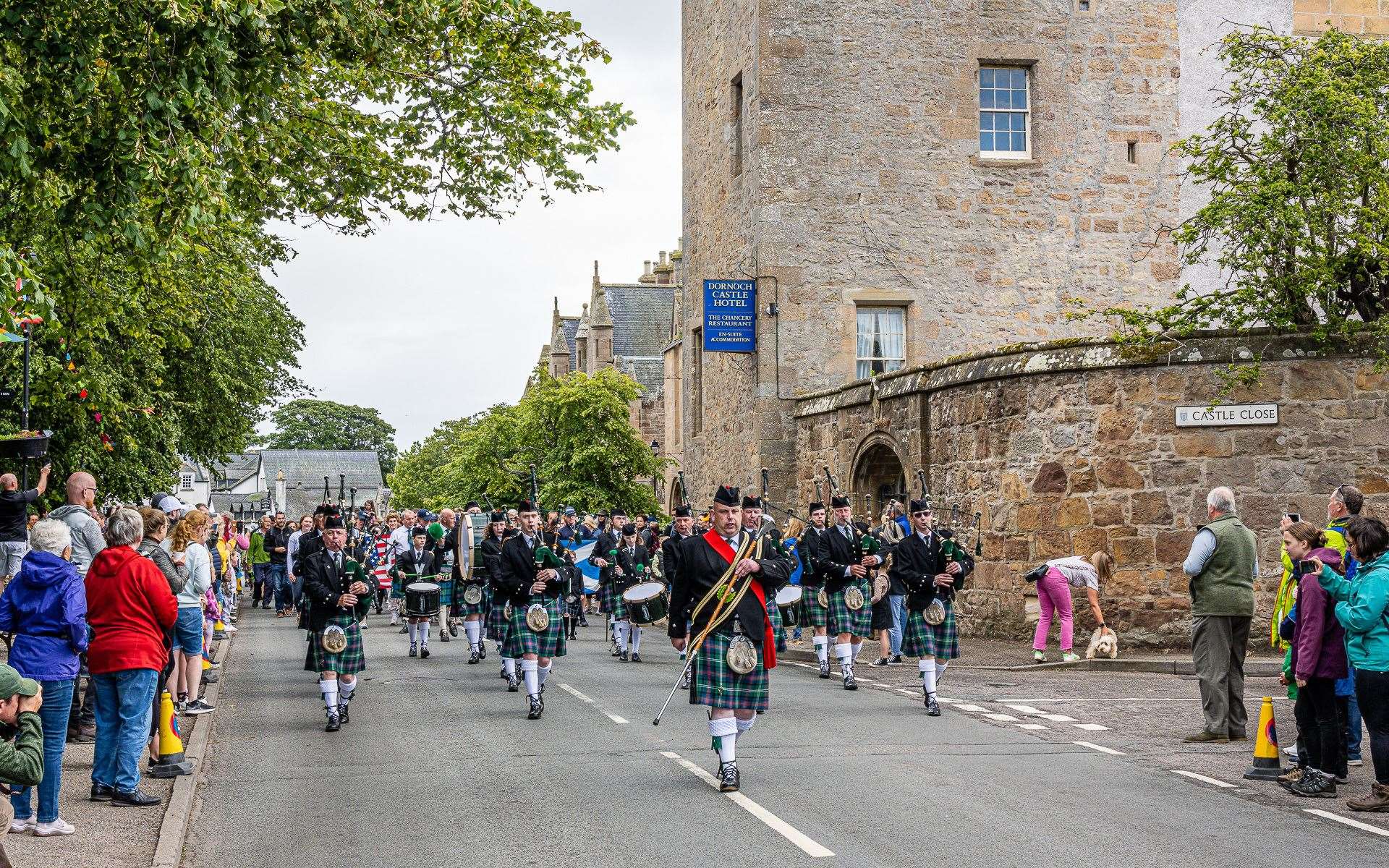Dornoch Pipe Band lead the chieftain's parade at Dornch Highland Gathering 2022. Picture: Andy Kirby