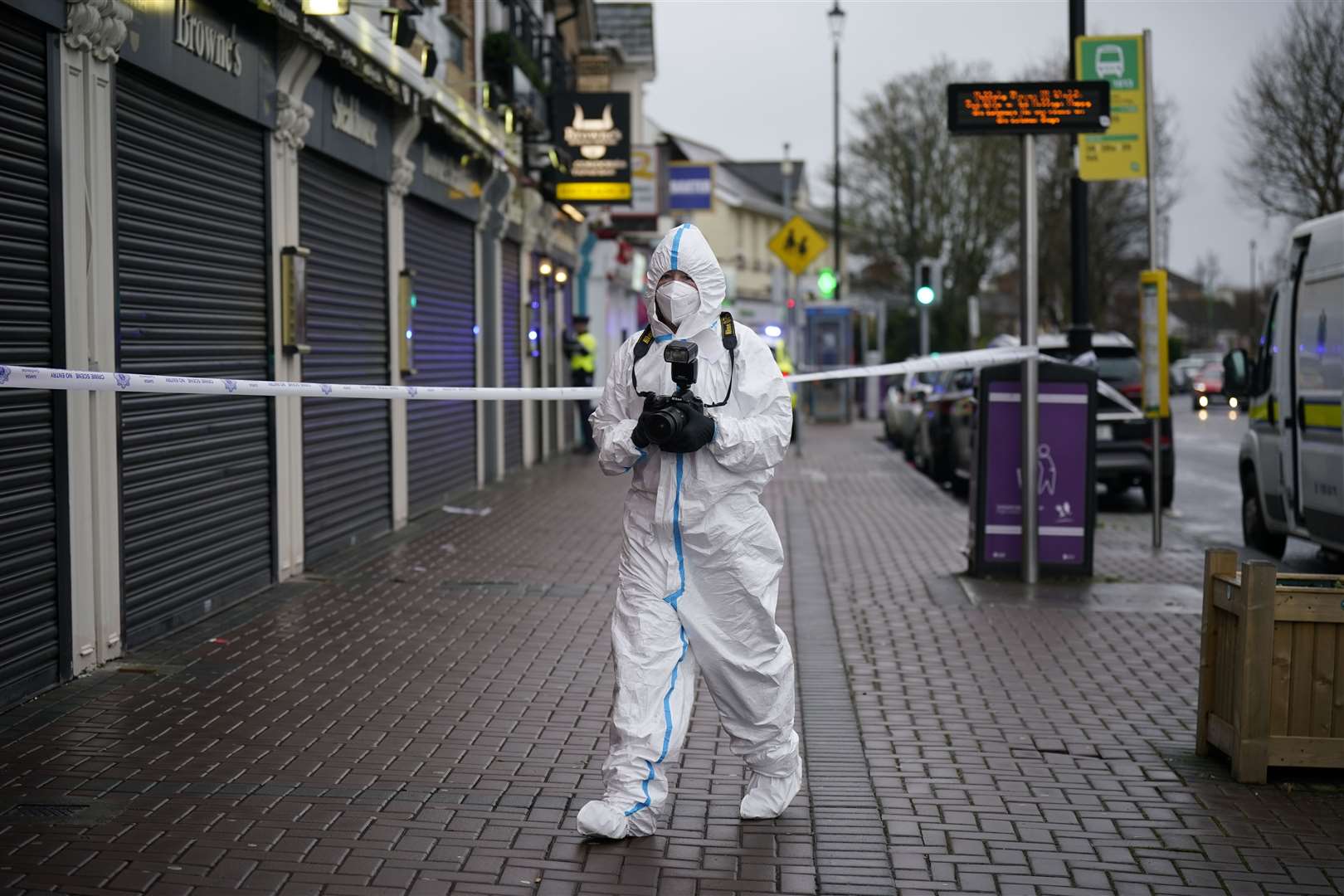 A forensic investigator at the scene (Niall Carson/PA)
