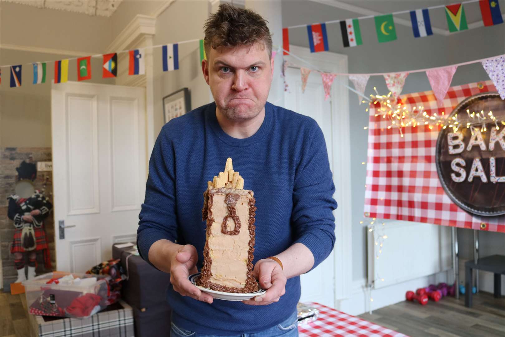 Marcus Doo with his chocolate Wallace monument cake. Picture: BBC Scotland/Raise the Roof Productions.