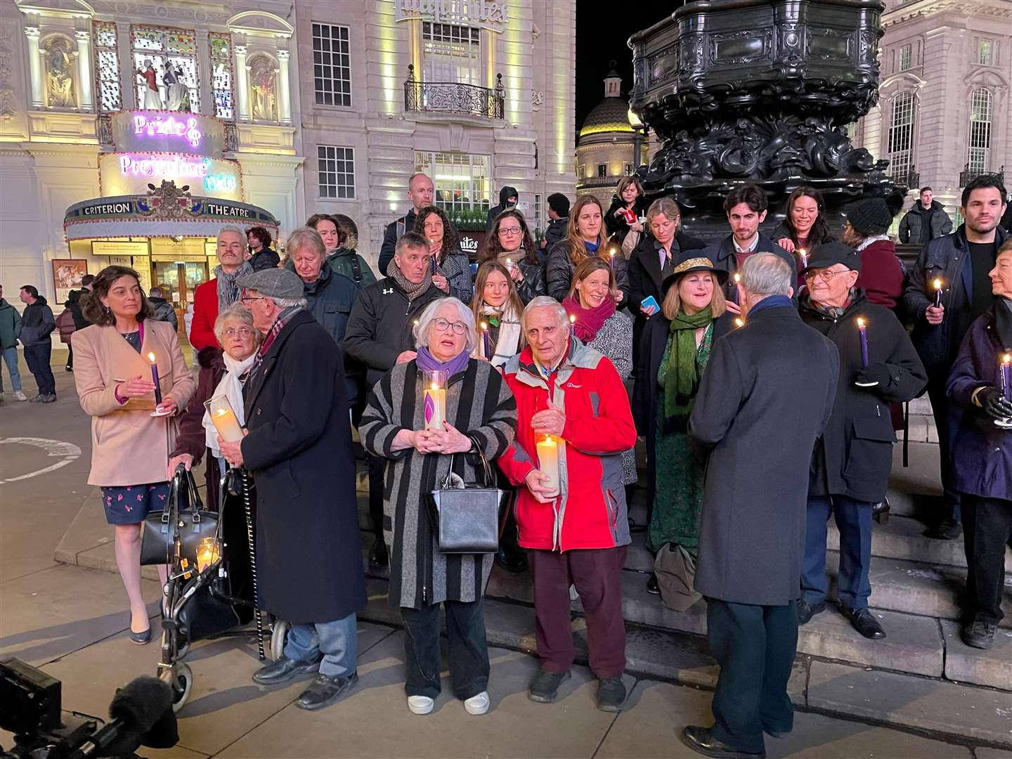 Holocaust survivors, including Steven Frank (front, centre), held candles in Piccadilly Circus to mark Holocaust Memorial Day (Sophie Wingate/PA)