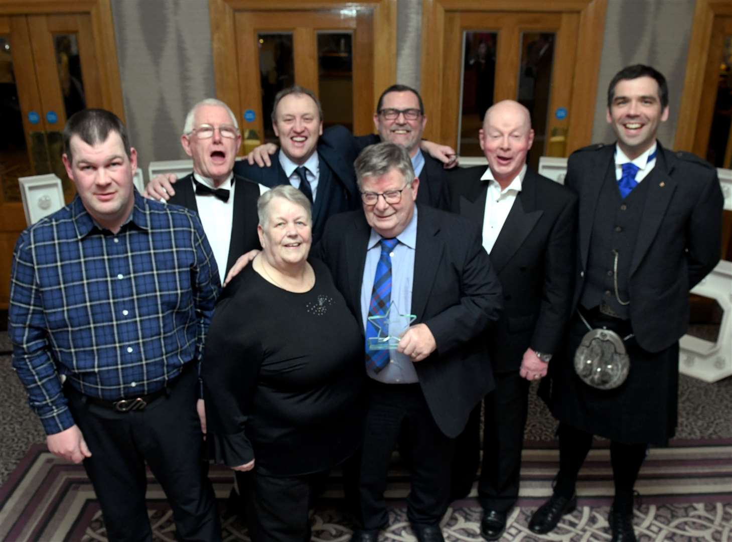 Ronnie Mitchell and friends at Highland Heroes 2023. The Volunteer of the Year award winner was a popular choice on the night. Picture: James Mackenzie.