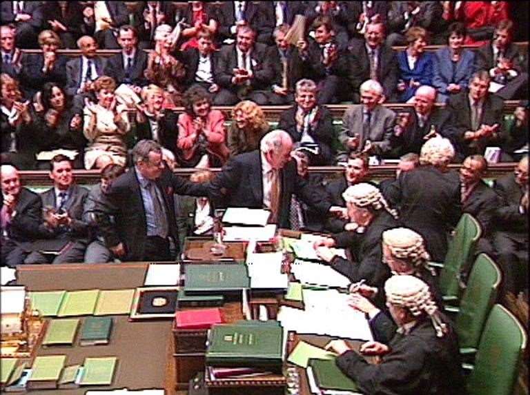 Michael Martin, centre, being ‘dragged’ to the Speaker’s chair by colleagues after being voted in as new House of Commons Speaker in 2000 (Alamy/PA)