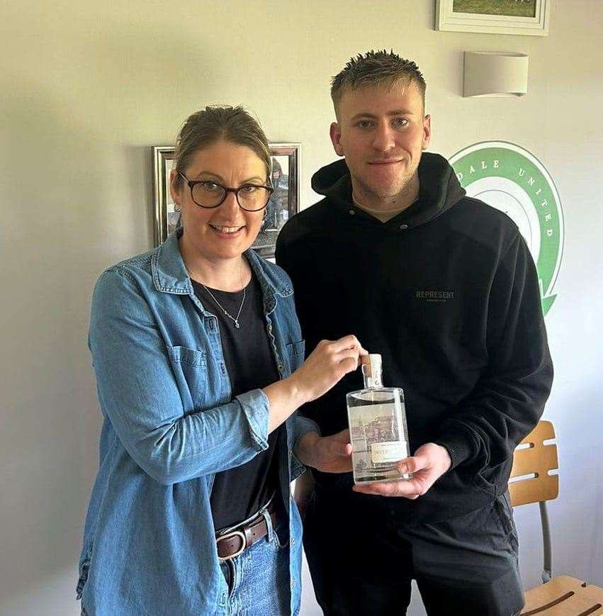 Helmsdale United forward Sam Barclay was presented with the man of the match award by match sponsor, Yvonne Grant from Glencoast.