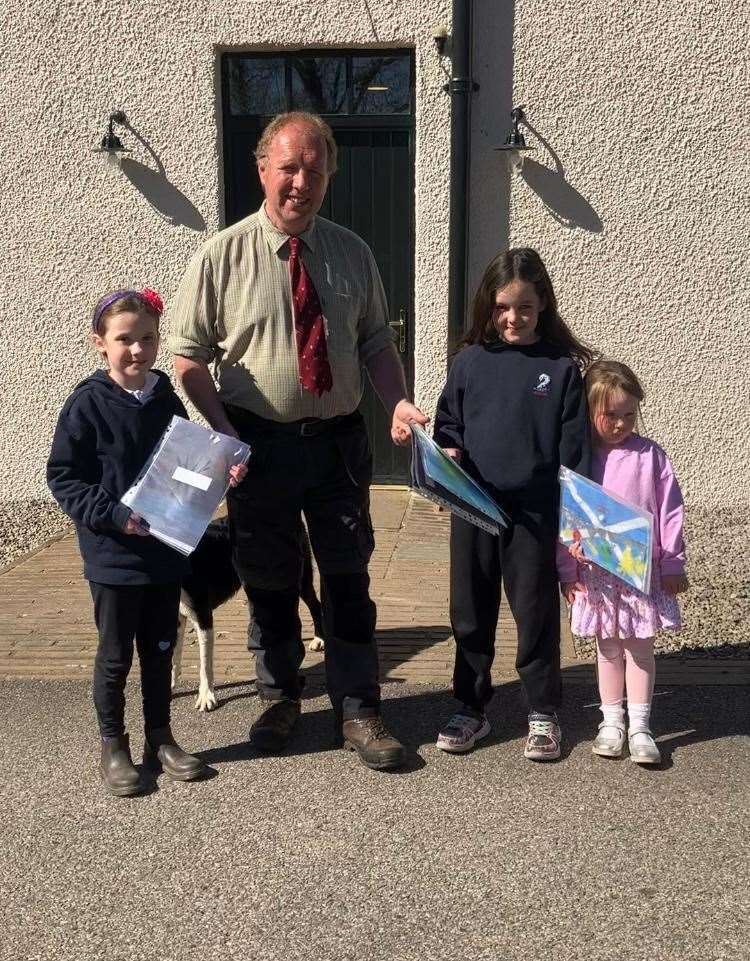 Pupil representatives from north-west Sutherland schools, including Kinlochbervie, Durness and Scourie primary schools and early learning centres, hand over their entries to Deputy-Lieutenant Neil Macdonald.
