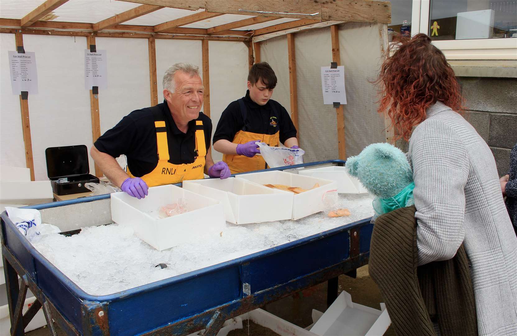 Wick RNLI's fresh fish stall was busy throughout the afternoon. Picture: Alan Hendry