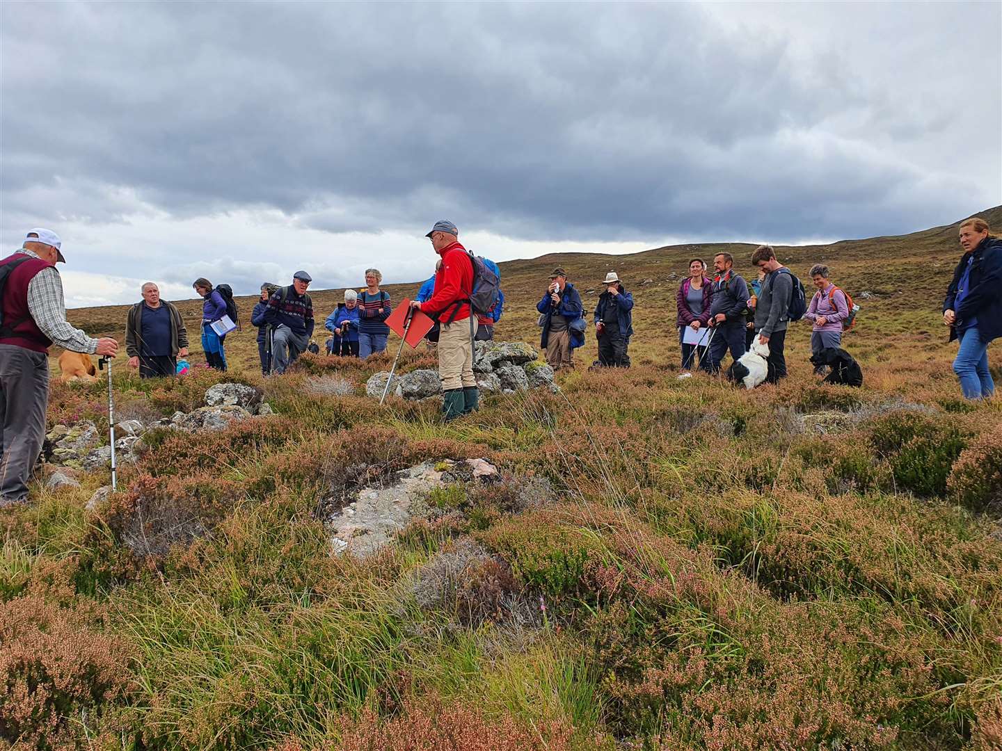 Dr Nick Lindsay shows the group a remote hillside building at Dubh Corrie.