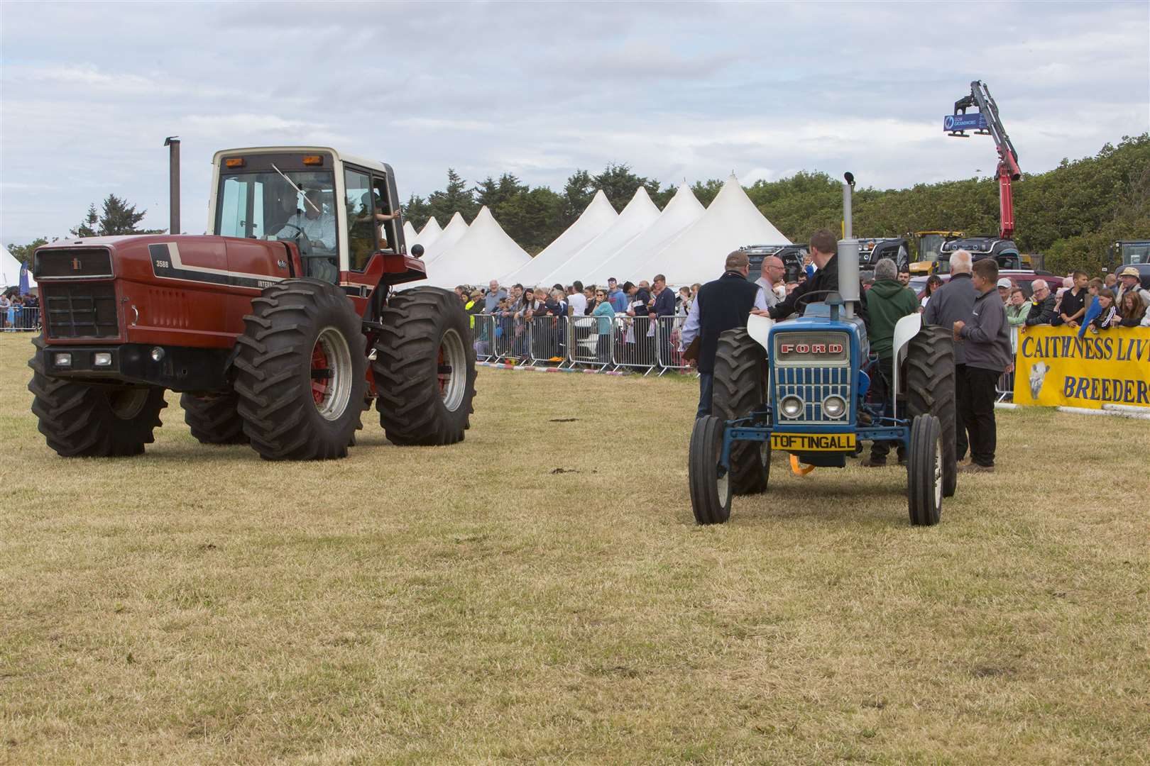 It's a case of little and large as this giant International 3588 passes a Fordson tractor during the parade of vintage machinery. Picture: Robert MacDonald / Northern Studios