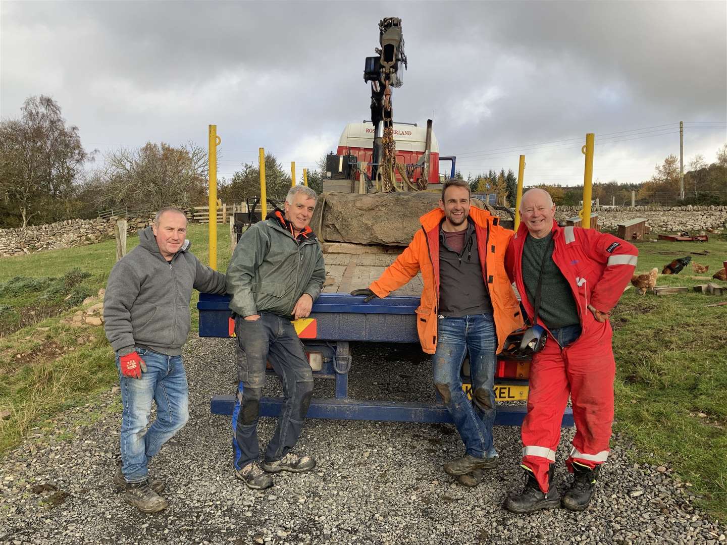 Up to the task of moving the huge stone were, from left, Chris Somerville, Bruce Shelley, Magnus Sinclair and Murdo Sutherland.