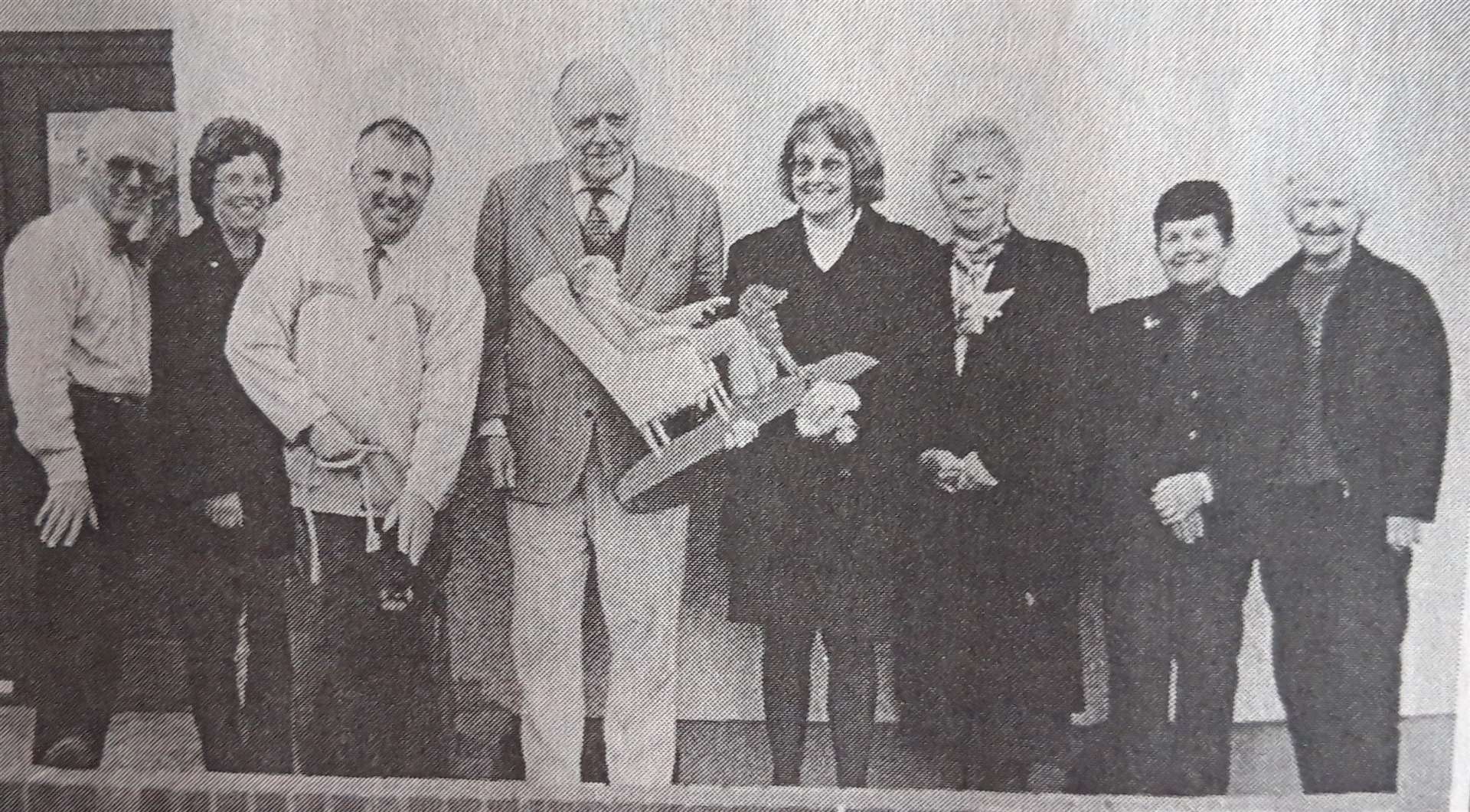 In this archive image, Creich, Kincardine and Croick Day Care Centre Committee joint secretary Agnes Calder presents the weather vane to Col. Sir Allan Gilmour in the company of fellow members, from left, Russell Taylor, Christine Milne, Stuart Milne, with Toddy the dog, Phyllis Ross, Alice Grant and Janet Maclean.