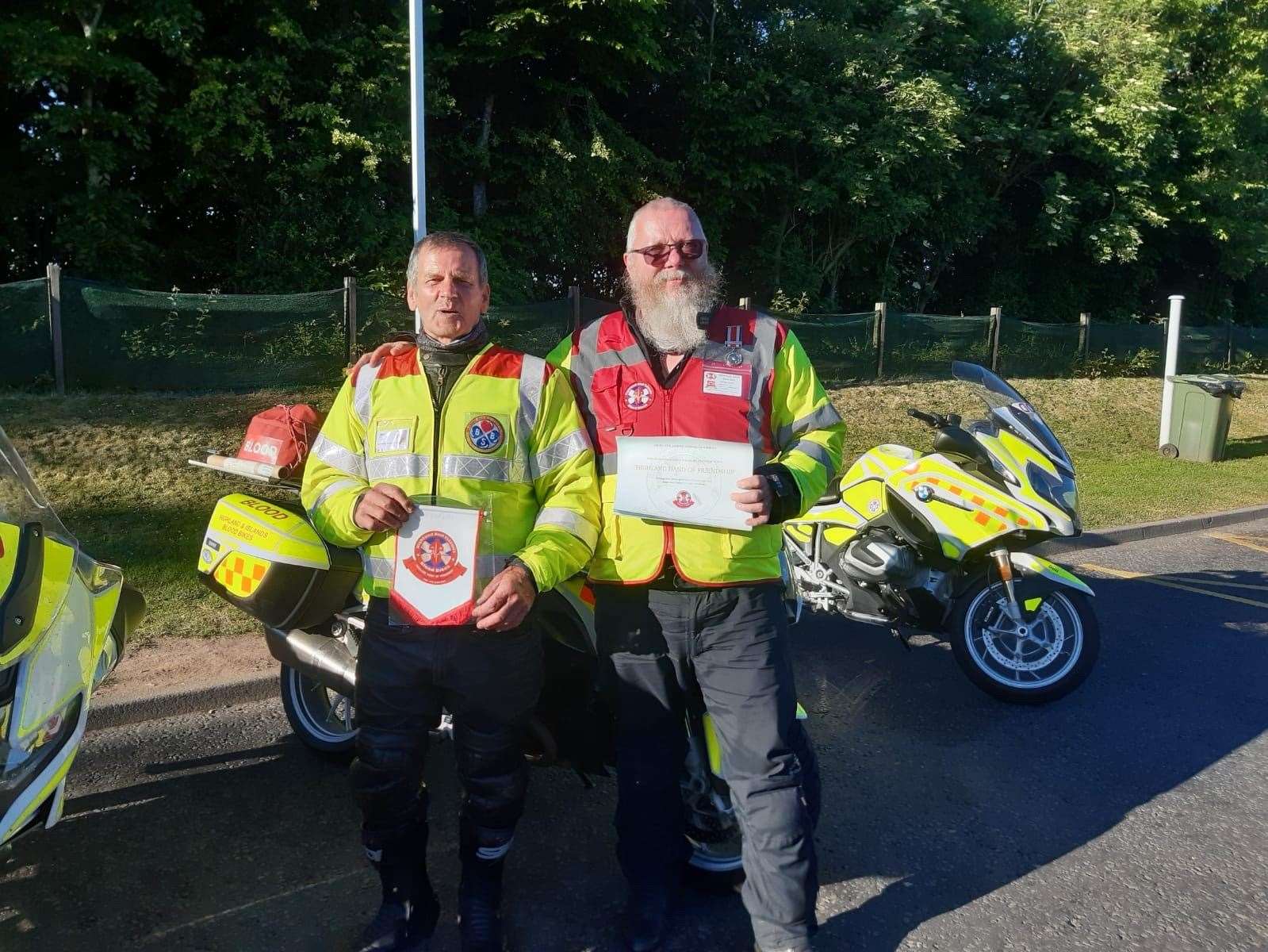 Thomas (right) with Brian from Blood Bikes Scotland.