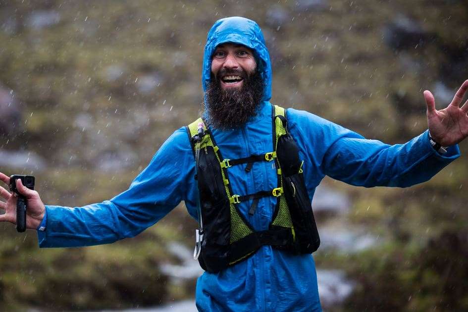 Smiling in the rain on day four of CWU2022 - ©Cape Wrath Ultra & No Limits Photography