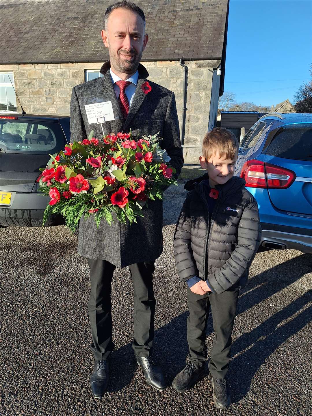 Scott Mackay and young Harris laid a wreath on behalf of Brora Rangers.