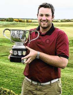Duncan Stewart with the North District championship trophy in 2007. He is selling shares in himself.