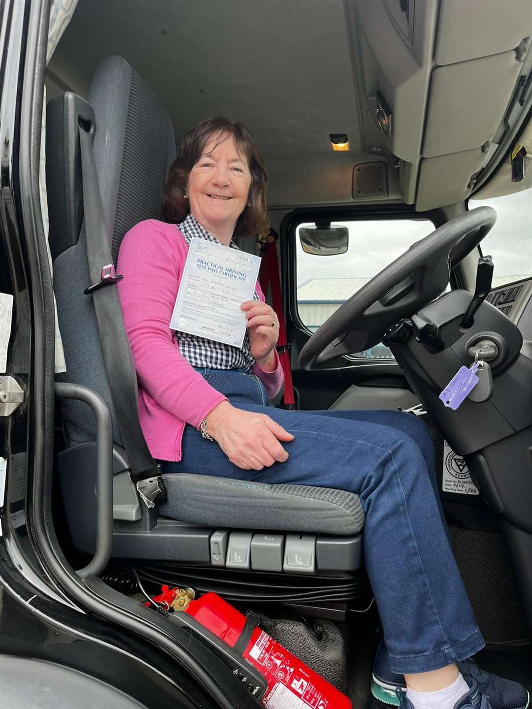 Ann proudly shows her LGV Cat C licence.