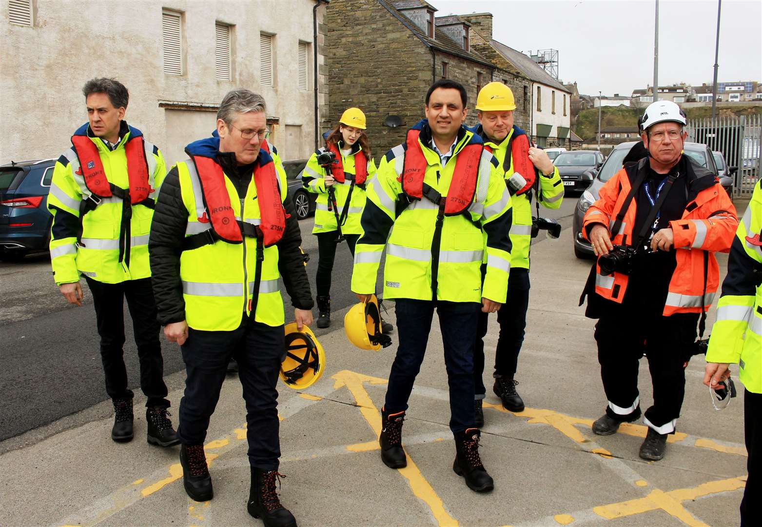 Ed Miliband (left) with Sir Keir Starmer, Anas Sarwar and others on their way to a crew transfer vessel that took them from Wick harbour to the Beatrice offshore wind farm. Picture: Alan Hendry