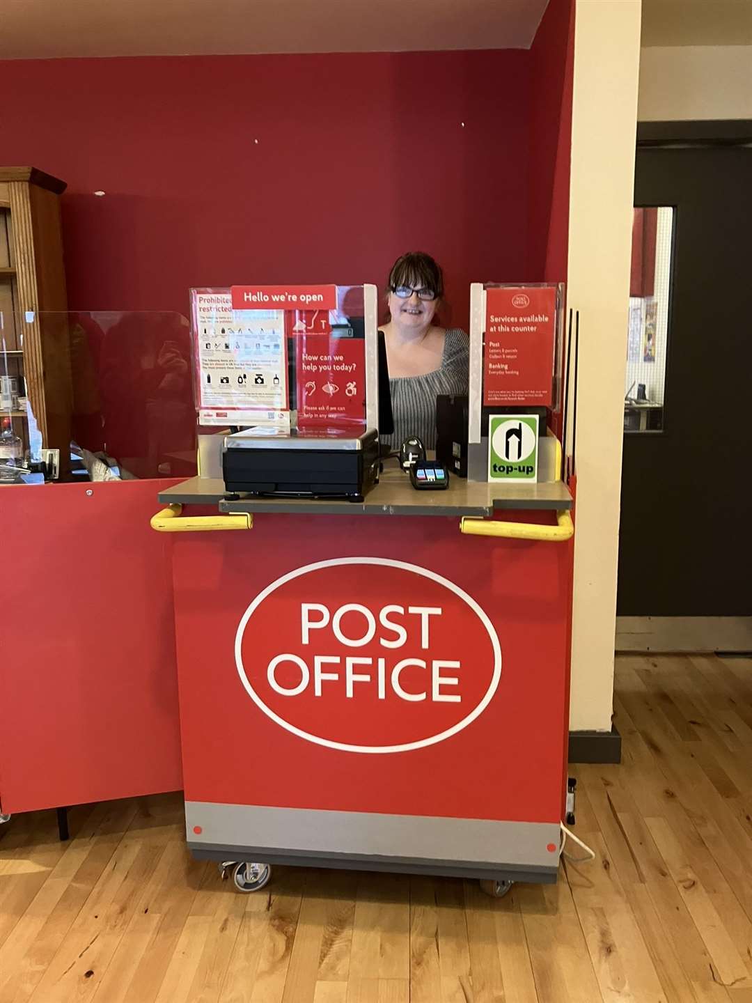 Heather Parlett at the temporary Post Office, in Ullapool Village Hall.