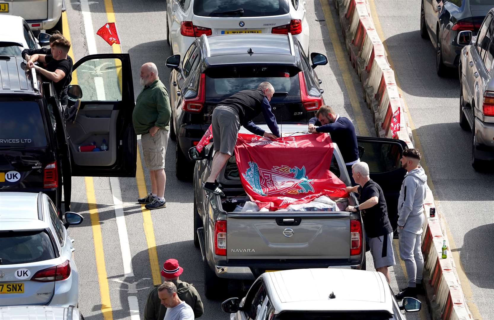 Liverpool supporters heading for the Champions League final in Paris wait amongst freight and holiday traffic queues at the Port of Dover in Kent (Gareth Fuller/PA)