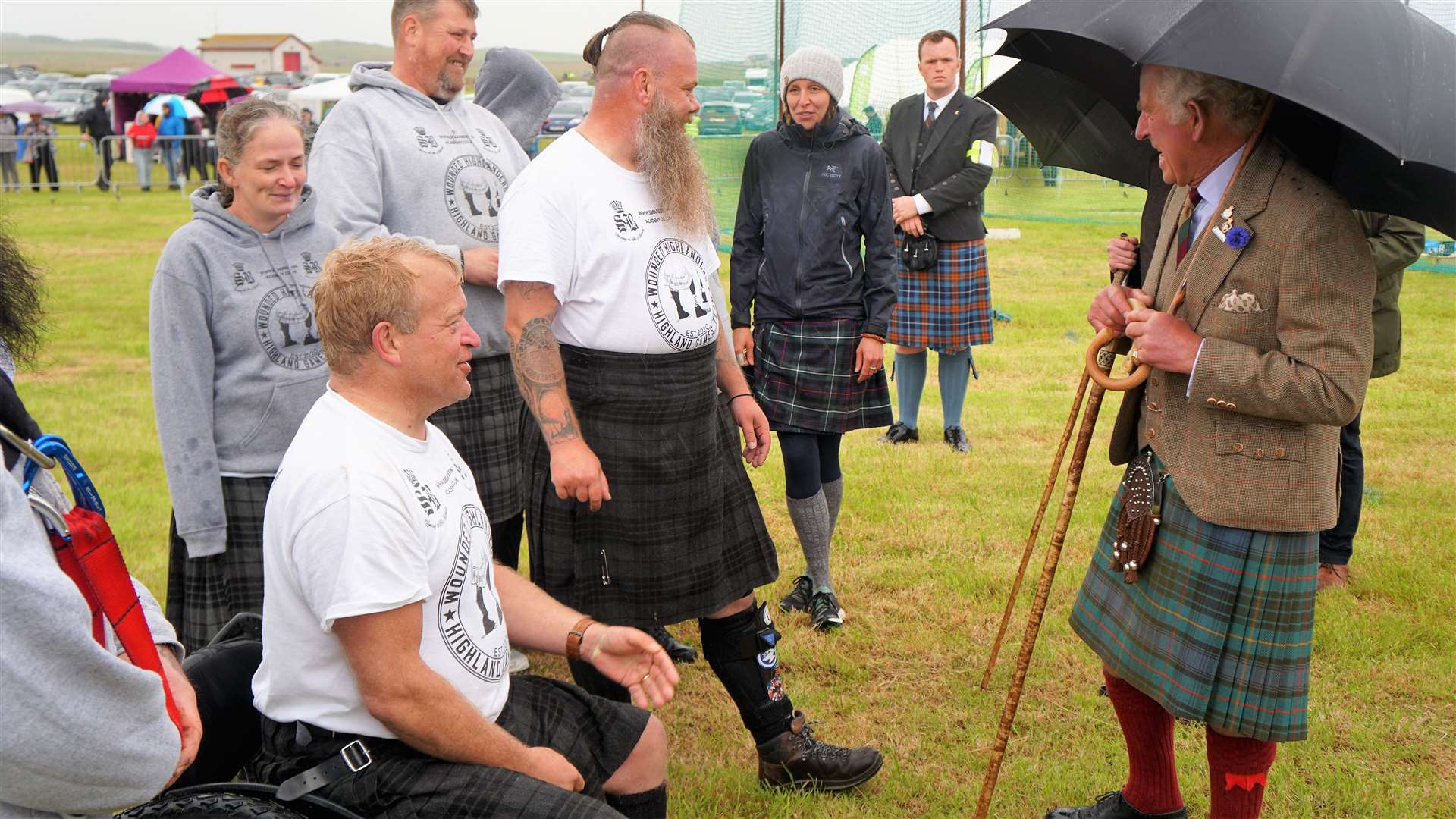 Prince Charles shares a joke with the Wounded Highlanders team. Picture: DGS