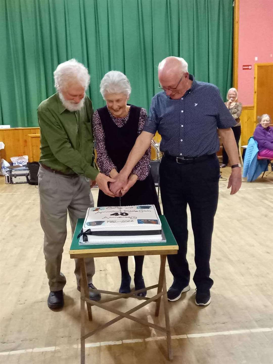 The three original members were given the honour of cutting the cake.