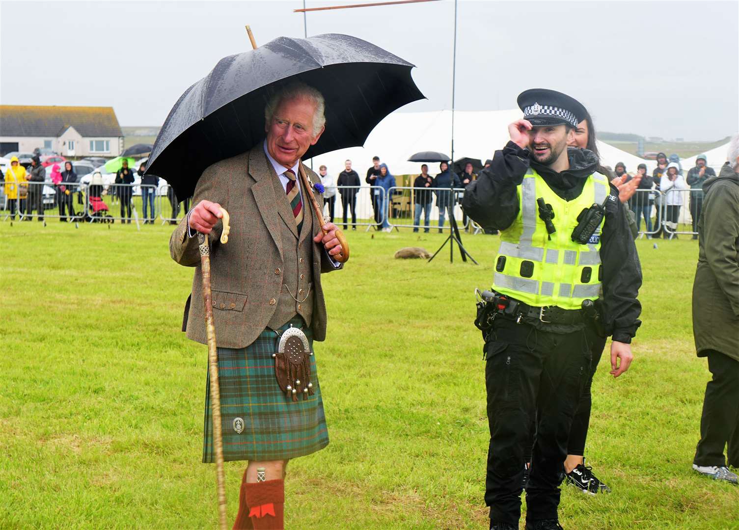Prince Charles consoles the police team after they lost the tug of war against the Wounded Highlanders. Picture: DGS